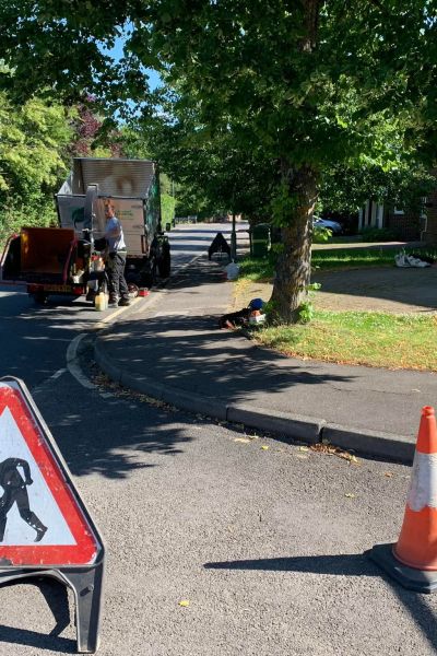 A road is closed so tree surgeons can conduct essential clearing after a storm.